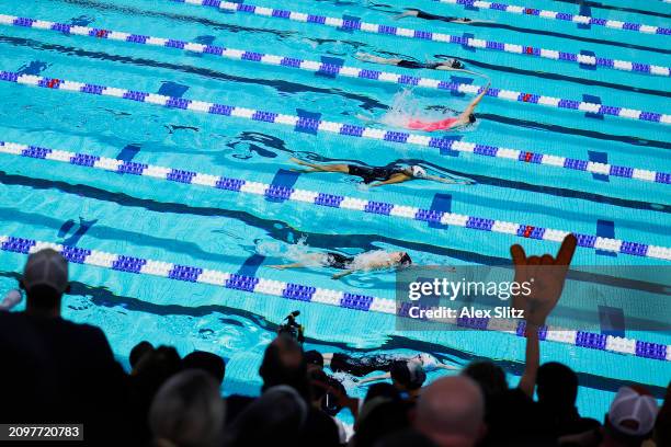 People cheer in the Women's 100 Yard Backstroke consolation finals during the Division I Women's Swimming and Diving Championships held at Ramsey...