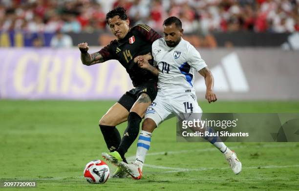 Gianluca Lapadula of Peru and Luis Coronel of Nicaragua fight for the ball during an international friendly between Peru and Nicaragua at Estadio...