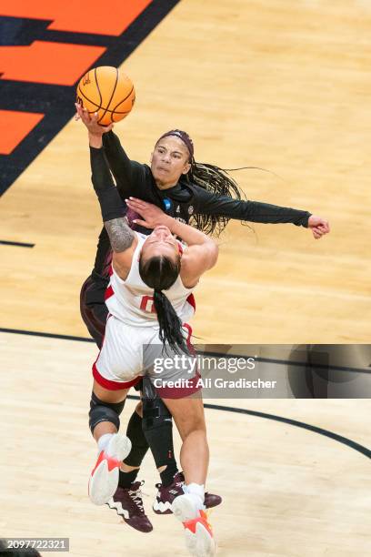 Guard Endyia Rogers of the Texas A&M Aggies fouls guard Darian White of the Nebraska Cornhuskers during the second quarter of a 2024 NCAA Women's...