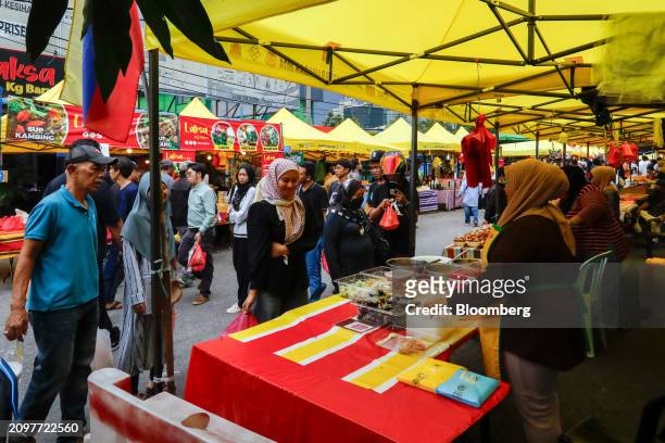 Shoppers at a food stall at a Ramadan bazaar in Kampong Bahru in Kuala Lumpur, Malaysia, on Friday, March 22. 2024. Malaysia is expected to release...