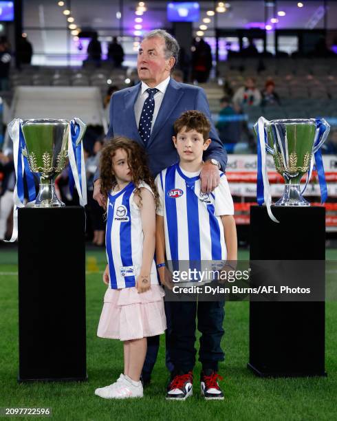 Denis Pagan is seen with his grand children Harrison and Francesca during the 2024 AFL Round 2 match between the North Melbourne Kangaroos and the...