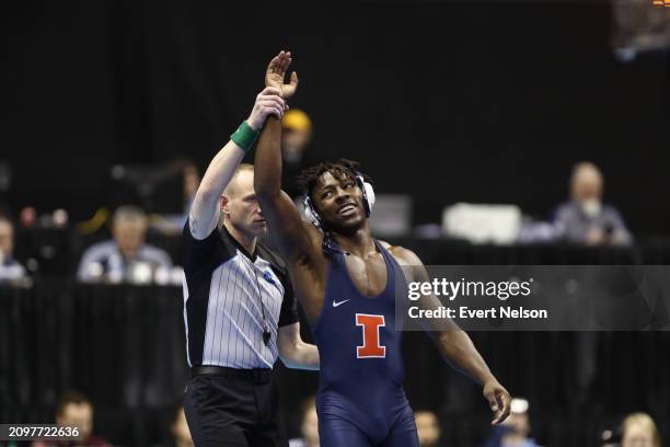 Edmond Ruth of the University of Illinois Fighting Illini wrestles MJ Gaitan of the Iowa State University Cyclones during the Division I Men's...