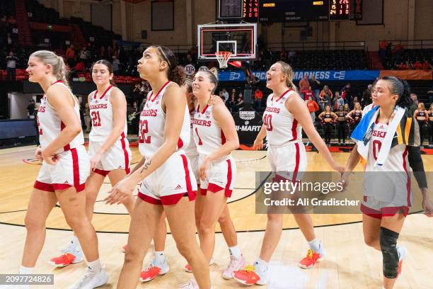 The Nebraska Cornhuskers react after their 61-59 victory over the Texas A&M Aggies during a 2024 NCAA Women's Basketball Tournament first round game...