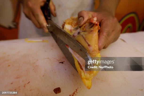 Chicken is being cut into pieces for sale at a market in Mexico City. Recently, the Ministry of Health of Tlaxcala in Mexico issued an...