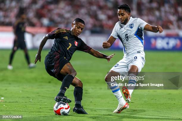 Andy Polo of Peru in action against Luis Coronel of Nicaragua during the international friendly match between Peru and Nicaragua at Estadio Alejandro...