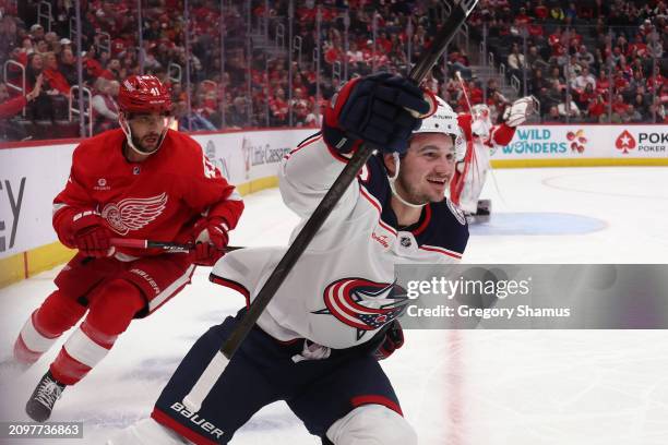 Alexandre Texier of the Columbus Blue Jackets celebrates his first period goal in front of Shayne Gostisbehere of the Detroit Red Wings at Little...