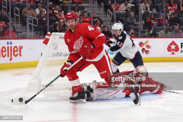 Jeff Petry of the Detroit Red Wings controls the puck in front of Alexandre Texier of the Columbus Blue Jackets during the first period at Little...