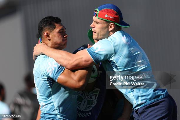 Rocco Berry and Roger Tuivasa-Sheck during a New Zealand Warriors NRL training session at Mt Smart Stadium on March 20, 2024 in Auckland, New Zealand.