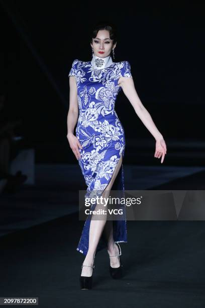 Model walks the catwalk for the Hu Sheguang Collection show during Beijing Fashion Week AW2024 on March 19, 2024 in Beijing, China.