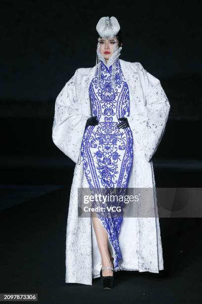 Model walks the catwalk for the Hu Sheguang Collection show during Beijing Fashion Week AW2024 on March 19, 2024 in Beijing, China.