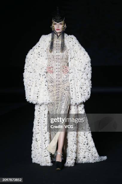 Model walks the catwalk for the Hu Sheguang Collection show during Beijing Fashion Week AW2024 on March 19, 2024 in Beijing, China.