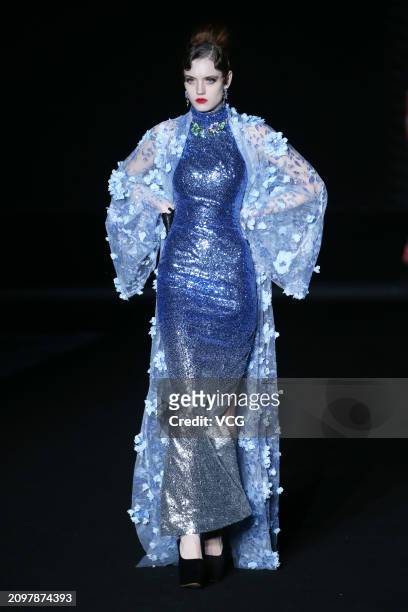 Model walks the catwalk for the Hu Sheguang Collection show during Beijing Fashion Week AW2024 on March 19, 2024 in Beijing, China.