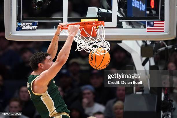 Joel Scott of the Colorado State Rams dunks the ball during the first half against the Virginia Cavaliers in the First Four game during the NCAA...