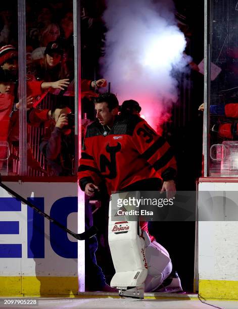 Jake Allen of the New Jersey Devils takes the ice after he is awarded the first star of the game after the game against the Pittsburgh Penguins at...
