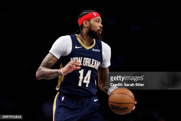 Brandon Ingram of the New Orleans Pelicans dribbles during the first half against the Brooklyn Nets at Barclays Center on March 19, 2024 in the...