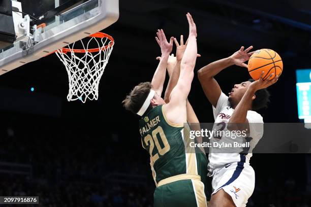 Reece Beekman of the Virginia Cavaliers shoots against Joe Palmer of the Colorado State Rams during the first half in the First Four game during the...