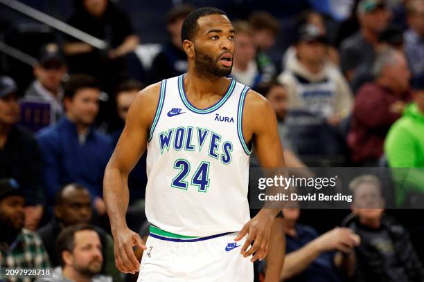 Warren of the Minnesota Timberwolves looks on against the Denver Nuggets in the first quarter at Target Center on March 19, 2024 in Minneapolis,...