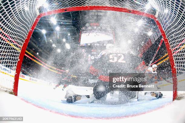 Pyotr Kochetkov of the Carolina Hurricanes defends against the New York Islanders at UBS Arena on March 19, 2024 in Elmont, New York. The Hurricanes...