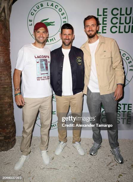 Grigor Dimitrov, Novak Djokovic and Daniil Medvedev attend the Le Club Lacoste Miami Open Presented By Itaú Launch Party at Soho Beach House on March...