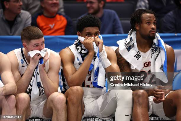 Isaac McKneely, Ryan Dunn, and Jordan Minor of the Virginia Cavaliers react during the second half against the Colorado State Rams in the First Four...