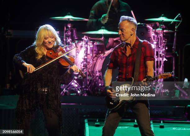 Soozie Tyrell and Bruce Springsteen perform at Footprint Center on March 19, 2024 in Phoenix, Arizona.