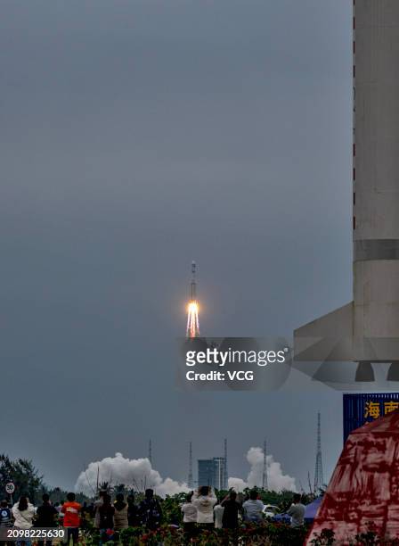 People gather and watch the launch of relay satellite Queqiao-2 at the Wenchang Spacecraft Launch Site on March 20, 2024 in Wenchang, Hainan Province...