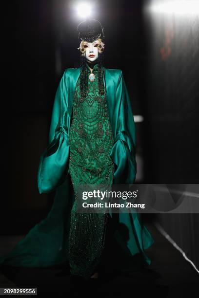 Model walks the runway during the dress rehearsal before Sheguang Hu Collection show at the Beijing Fashion Week AW2024 on March 19, 2024 in Beijing,...