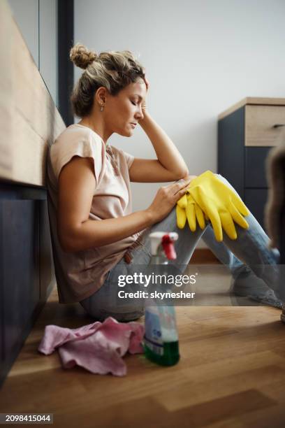 exhausted maid taking a break from chores. - overworked stock pictures, royalty-free photos & images