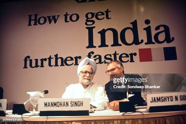 Finance Minister Manmohan Singh with business leaders Jamshyd Godrej during a conference of the Conferderation of Indian Industry to discuss India's...