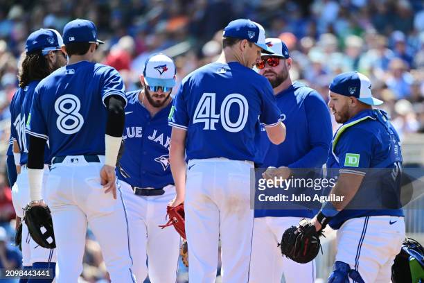 Chris Bassitt of the Toronto Blue Jays is relieved by manager John Schneider in the fourth inning against the Baltimore Orioles during a 2024...