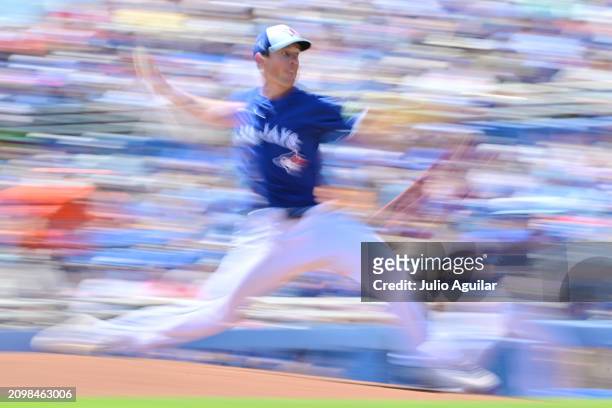 Chris Bassitt of the Toronto Blue Jays delivers a pitch to the Baltimore Orioles in the first inning during a 2024 Grapefruit League Spring Training...