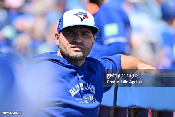 Joey Votto of the Toronto Blue Jays looks on from the dugout during a 2024 Grapefruit League Spring Training game against the Baltimore Orioles at TD...