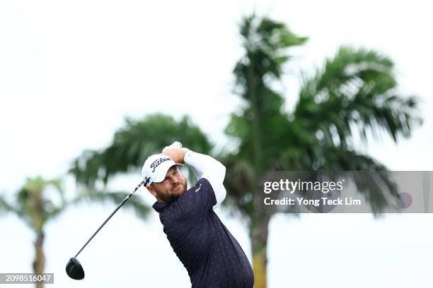 Jordan Smith of England plays his shot from the ninth tee during a pro-am tournament prior to the Porsche Singapore Classic at Laguna National Golf...