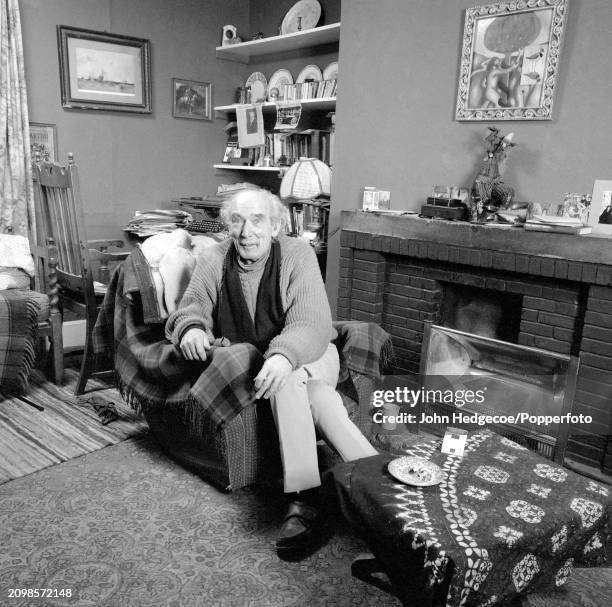 English poet George Barker seated in an armchair at home in Norfolk, England in 1966. George Barker and his family have recently moved to the village...