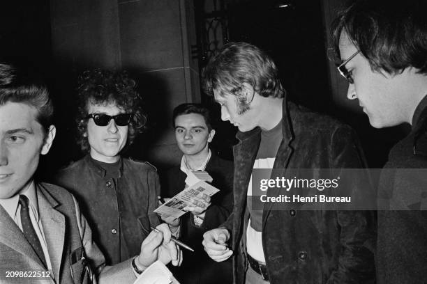 American singer and songwriter Bob Dylan with french singer Johnny Hallyday in Paris, 24th May 1966.