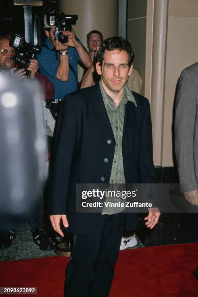 American actor and comedian Ben Stiller, wearing a black suit with a pale green shirt, attends the Miramax Films Pre-Oscar Party, held at the Beverly...