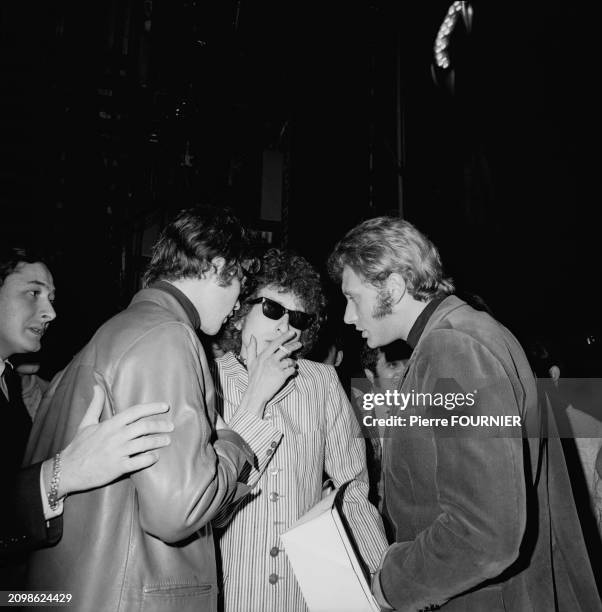 American singer and songwriter Bob Dylan with french singe Johnny Hallyday in Paris, 24th May 1966.