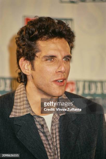 American actor and comedian Ben Stiller, wearing a dark grey jacket over a checked shirt, in the press room of the 1994 MTV Video Music Awards, held...