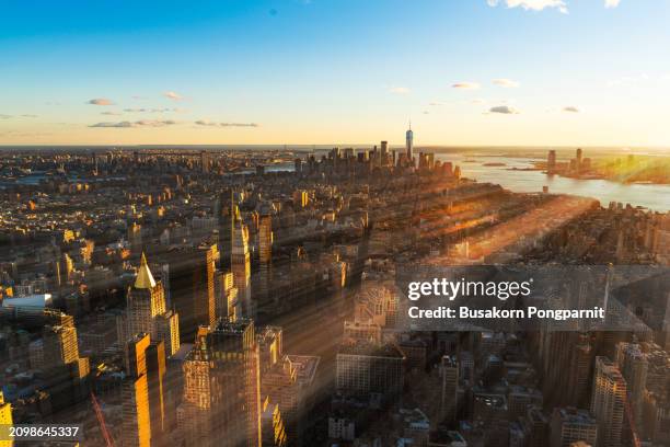 aerial of manhattan, nyc at sunset - wall street aerial stock pictures, royalty-free photos & images