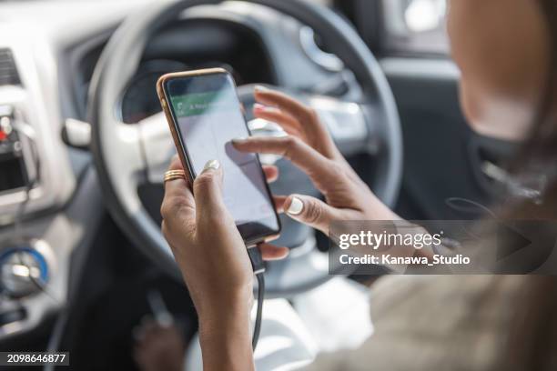unrecognizable female driver using google maps to check location - touch screen map stock pictures, royalty-free photos & images