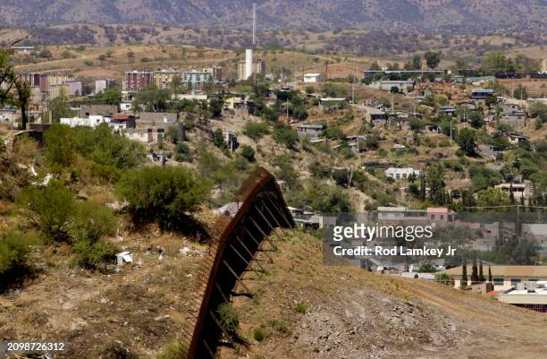Elevated view along the border wall between the United States & Mexico, Nogales, Arizona, July 25, 2002.