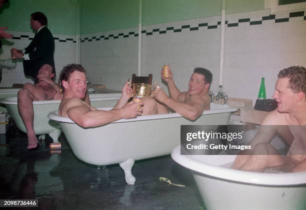 Australian Team mates Simon Poidevan and Phil Kearns and Michael Lynagh celebrate the Australian victory over England in the 1991 IRB World Cup Final...