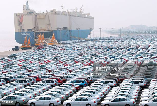 Hyundai Motors cars wait for shipping at the port June 20 2003 in Ulsan, south of Seoul, South Korea. Founded in 1961, Hyundai Motor has scaled...
