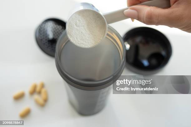 concept of sports nutrition - protein shaker stock pictures, royalty-free photos & images