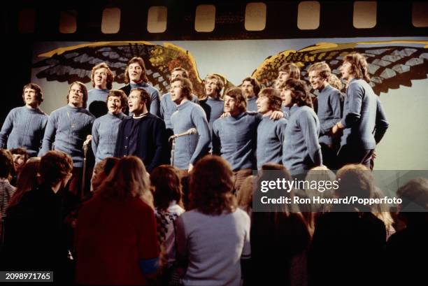 Members of the Chelsea football team, featuring striker Peter Osgood and defender Ron Harris in centre of front row, perform the song 'Blue Is The...