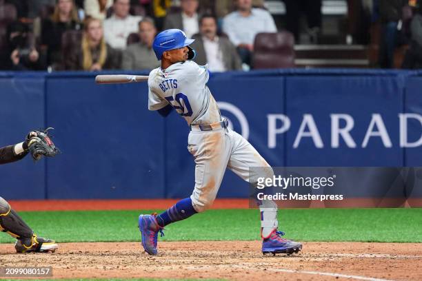 Mookie Betts of the Los Angeles Dodgers hits a RBI single in the 8th inning during the 2024 Seoul Series game between Los Angeles Dodgers and San...
