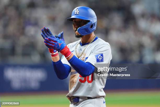 Mookie Betts of the Los Angeles Dodgers celebrates hitting a RBI single in the 8th inning during the 2024 Seoul Series game between Los Angeles...