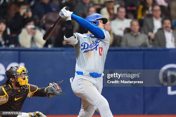 Shohei Ohtani of the Los Angeles Dodgers hits a RBI single in the 8th inning during the 2024 Seoul Series game between Los Angeles Dodgers and San...