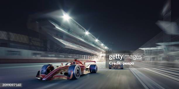 two racing cars driving at speed down a straight at night - motor racing track stock pictures, royalty-free photos & images