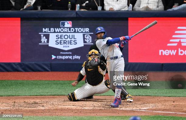 Mookie Betts of Los Angeles Dodgers hits a RBI single in the the top of the eighth inning during the 2024 Seoul Series game between Los Angeles...